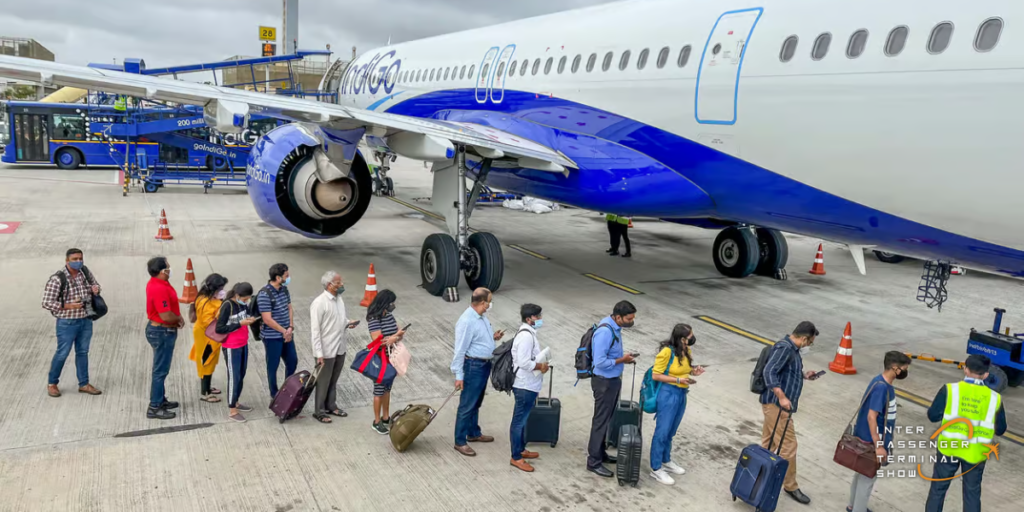 Crowded Indian airport terminal during the festive season with passengers queuing