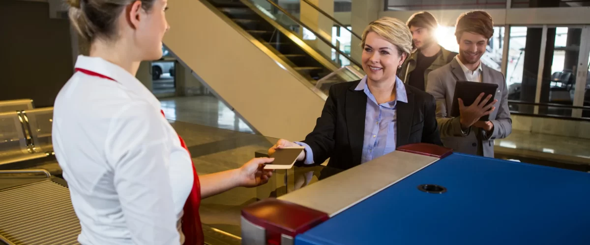businesswoman-queue-receiving-passport-boarding-pass